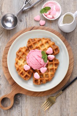 delicious waffle with chocolate and ice cream