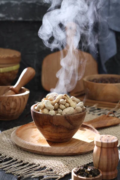 stock image traditional turkish coffee beans in a clay pot on a wooden table.