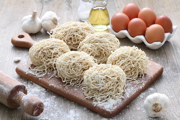 stock image raw pasta with flour and eggs 