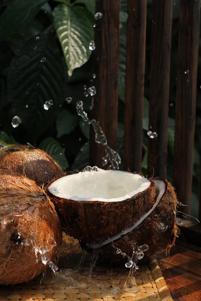 coconut with coconut oil, coconut oil, milk and coconut milk