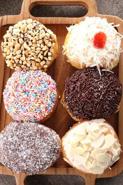 Lot Donuts Different Flavors Wooden Background — Stock Photo, Image