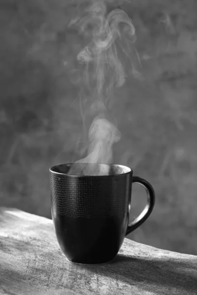 coffee cup with steam. black and white photo
