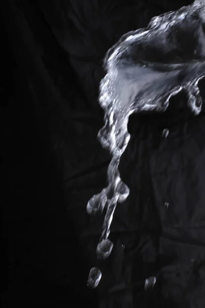 black water splash on black background