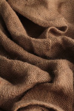 Kahverengi örgü kumaş. bir kumaşın arkaplanı.