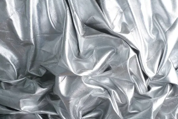 銀粉砕ホイルの抽象的な背景 — ストック写真