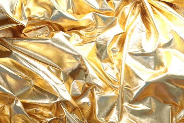 光沢のある金ホイル 抽象的な光沢のある背景 ゴールデンメタリックテクスチャ 光沢のある金ホイルの背景 金属の金の光沢のある金属のホイル — ストック写真