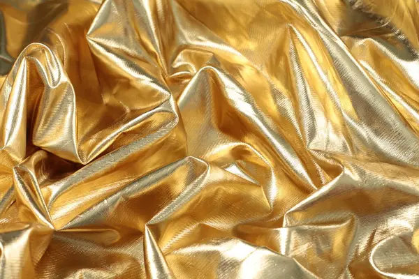 Golden Crumpled Paper Folds Stock Photo