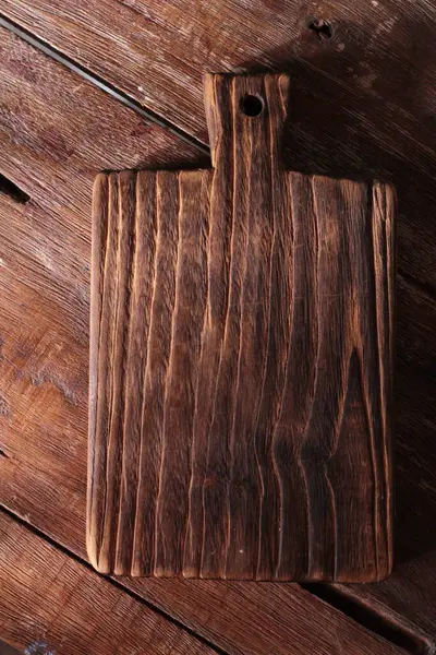 wooden cutting board on the wooden table