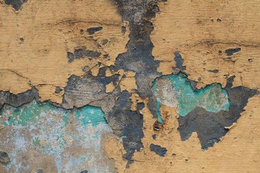 Paslı metal bir duvarın dokusu, eski çatlak boya, arka plan