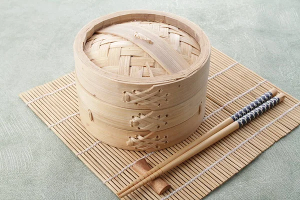 chinese bamboo bowl with chopsticks
