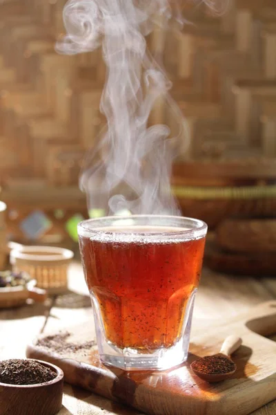 hot tea in a cup with smoke