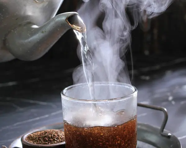 tea in glass cup with smoke