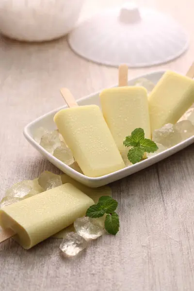 ice - cream with mint leaves and mint leaves