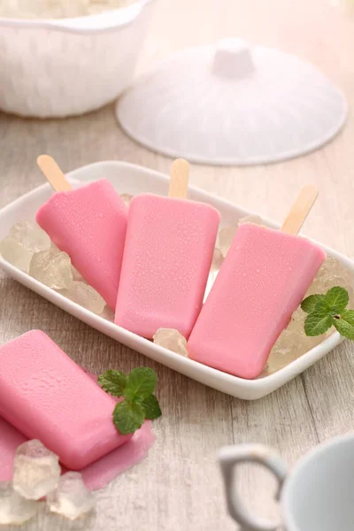 pink ice cream on stick