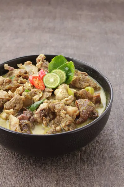 Goat curry is a traditional Indonesian dish made from lamb or goat meat cooked in a spicy, yellowish curry-like sauce called gulai.