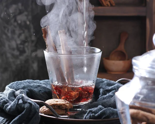 cup of hot tea with cinnamon, anise