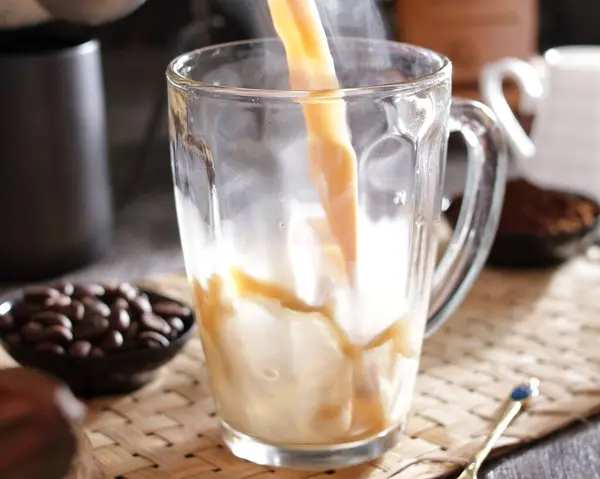 iced coffee in glass with ice cubes
