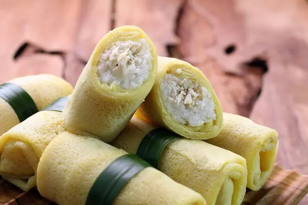 Stock image roll filled with cottage cheese and banana leaves