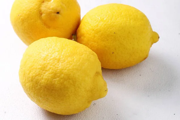 yellow lemons in a white background