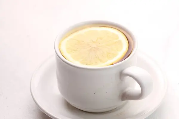 cup of coffee and lemon on a white background