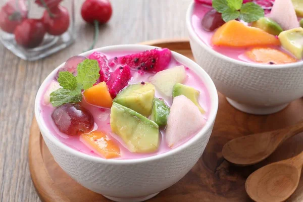 fresh fruit salad with yogurt, strawberry and kiwi