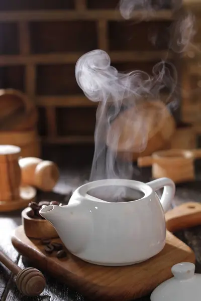 hot coffee cup with steam and cinnamon stick
