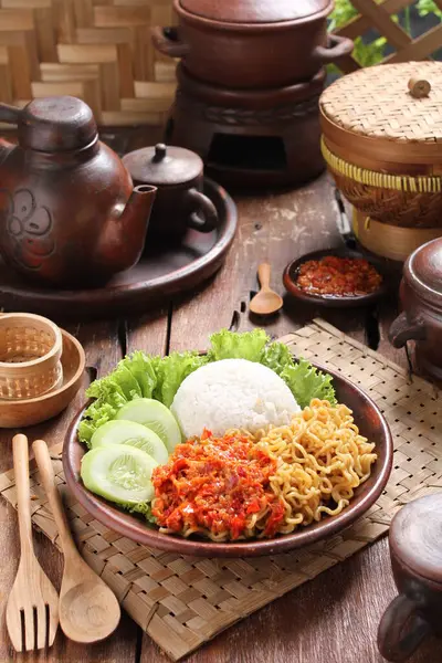 Food photography is a still life photography genre used to create attractive still life photographs of food. As a specialization of commercial photography,