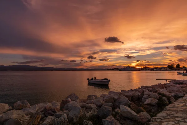 A wonderful sunset over the Greek sea. Greek landscapes. Travels around Greece. Greek islands. Travel photography. Holiday atmosphere. Colorful sky. Holiday postcards.