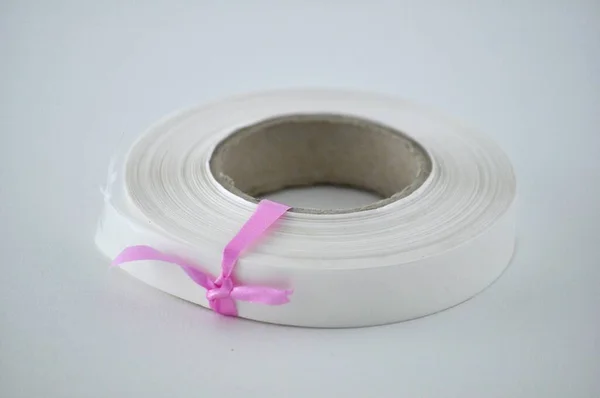 White Plastic Tape Gray Background — Stock Photo, Image