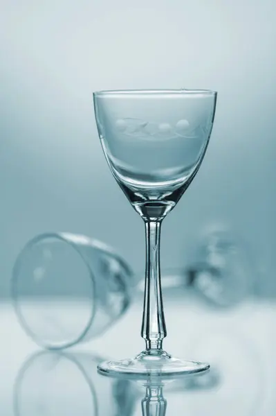 Crystal glasses on a blue background.