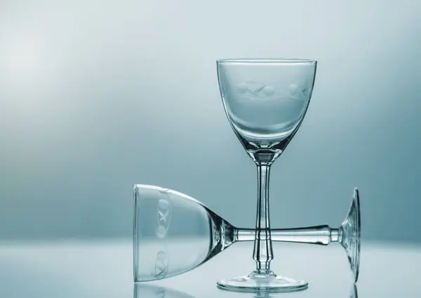 Crystal glasses on a blue background.