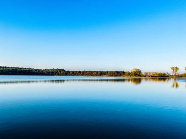 beautiful landscape with lake and blue sky clipart