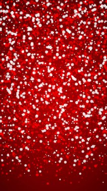 Sihirli kar yağışı arkaplanı. İnce uçan kar taneleri ve kırmızı arka plandaki yıldızlar. Sihirli yağan kar tatili manzarası. Dikey vektör illüstrasyonu.