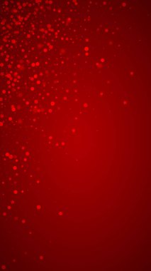 Karlı bir Noel geçmişi var. İnce uçan kar taneleri ve kırmızı arka plandaki yıldızlar. Narin, tatlı, karlı bir Noel. Dikey vektör illüstrasyonu.