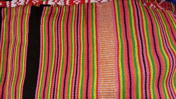 Tais weaving in Timor Leste, symbolizing freedom and cultural identity. The traditional textile is vital for Timorese life, used for decoration and clothing styles for men and women.