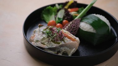 a cuisine photo of fish steak with microgreen and rice, Asian food