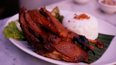 Smocked Duck with rice and vegetable. 