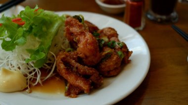 Chicken Karage with mayonaise sauce on white plate. Japanese food.