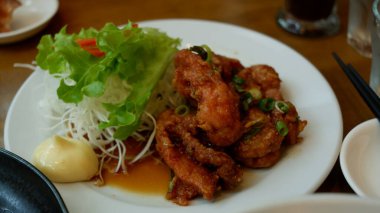 Chicken Karage with mayonaise sauce on white plate. Japanese food.