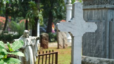 the tombstone of the cross-shaped stone in the cemetery. Prasasti Museum, Jakarta. 18 April 2022.