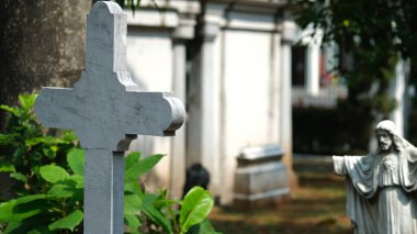 the tombstone of the cross-shaped stone in the cemetery. Prasasti Museum, Jakarta. 18 April 2022.