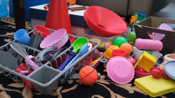 Children\'s plastic toys scattered in the living room.