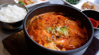 Korean spicy seafood soft tofu stew. clipart