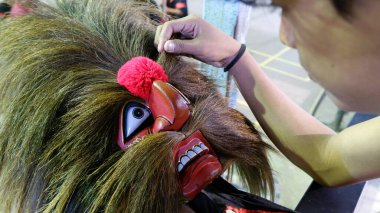 Topeng Bujang Ganong or Topeng Reog jaranan is mask for a dancer in the art of Reog Ponorogo who depicts a young patih figure who is deft, clever, witty, and magical. clipart