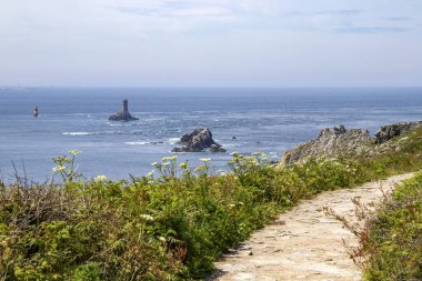 The Pointe du Raz and the Vieille lighthouse. Brittany. Finistere. France clipart