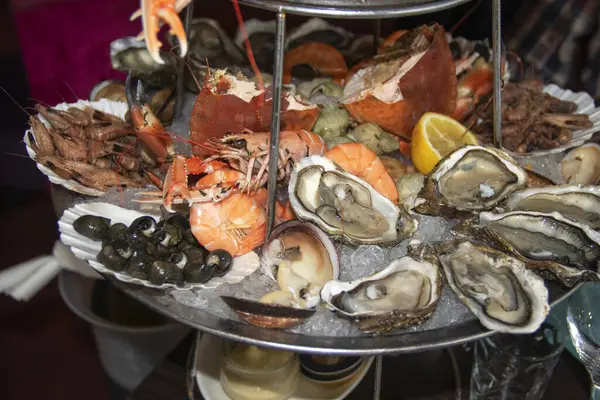 Seafood platter with oysters, langoustines, crabs, clams, prawns, whelks, crabs, prawns