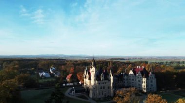 drone flight over old medieval castle, beautiful view of nature, golden hour