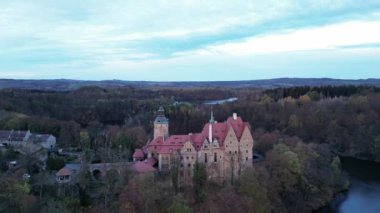 drone flight over old medieval castle, beautiful view of nature, golden hour
