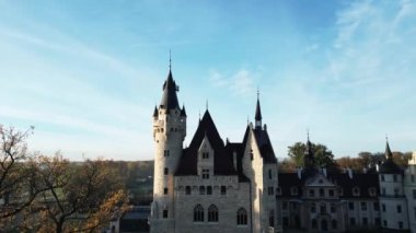 drone flight over old medieval castle, beautiful view of nature, golden hour