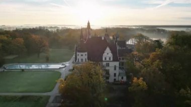 drone flight over old medieval castle, beautiful view of nature, golden hour